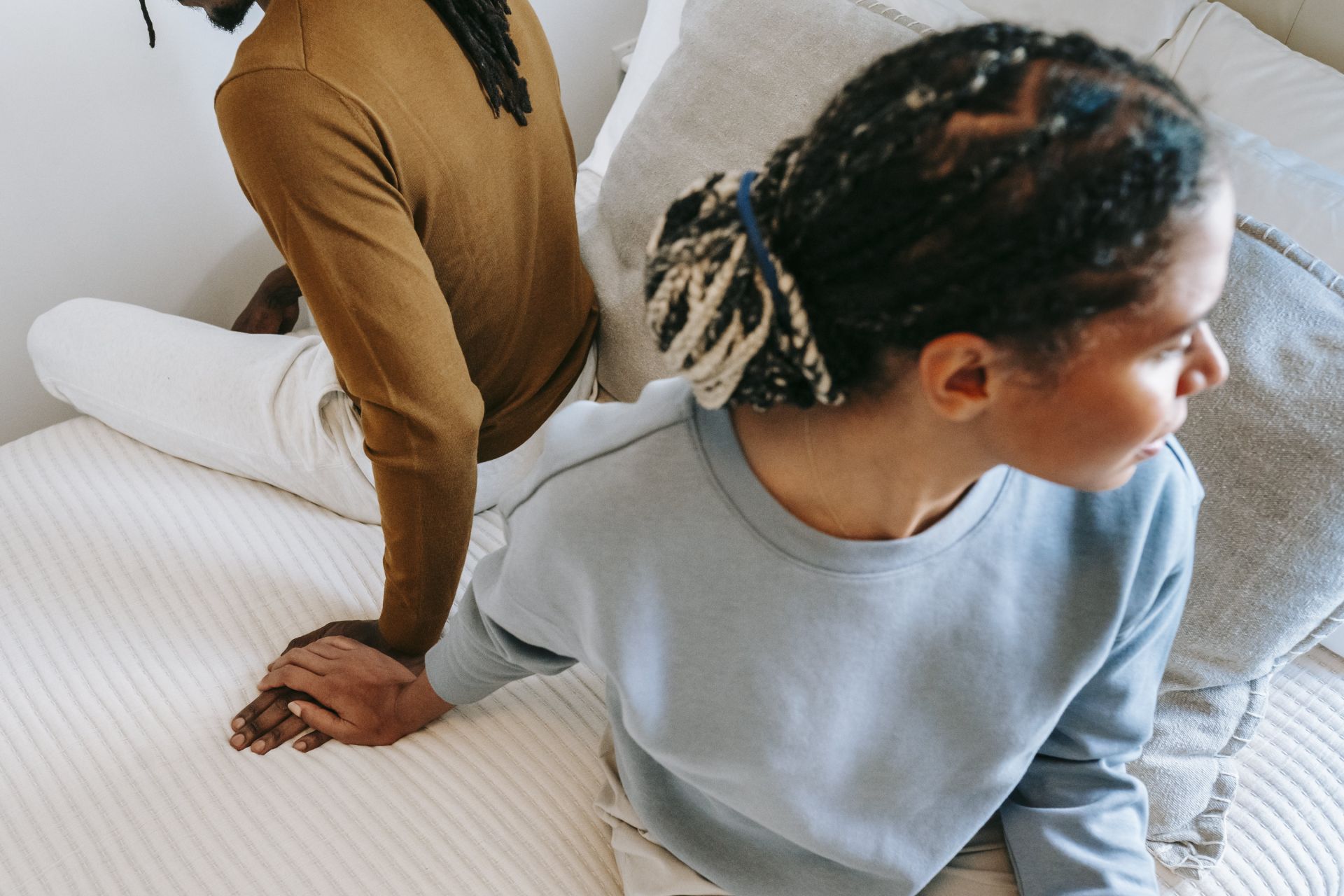 African American couple spending time on bed